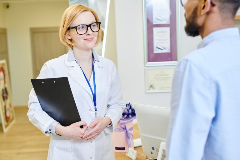 Pretty Doctor Talking to Patient