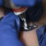 experienced-tattoo-artist-working-client-tattoo