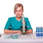 Scientists looking through a microscope