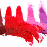 Different multi colored samples of a smudged lipstick